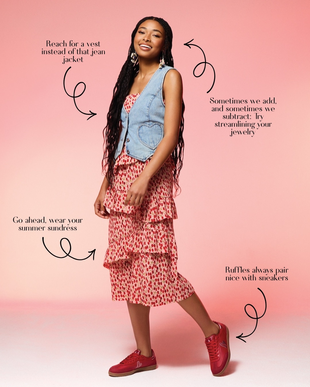 A woman stands smiling in a pink floral sundress, light denim vest, and red sneakers against a pink background—showcasing the perfect spring outfit. Arrows highlight style tips about vests, jewelry, sundresses, and pairing ruffles with sneakers.