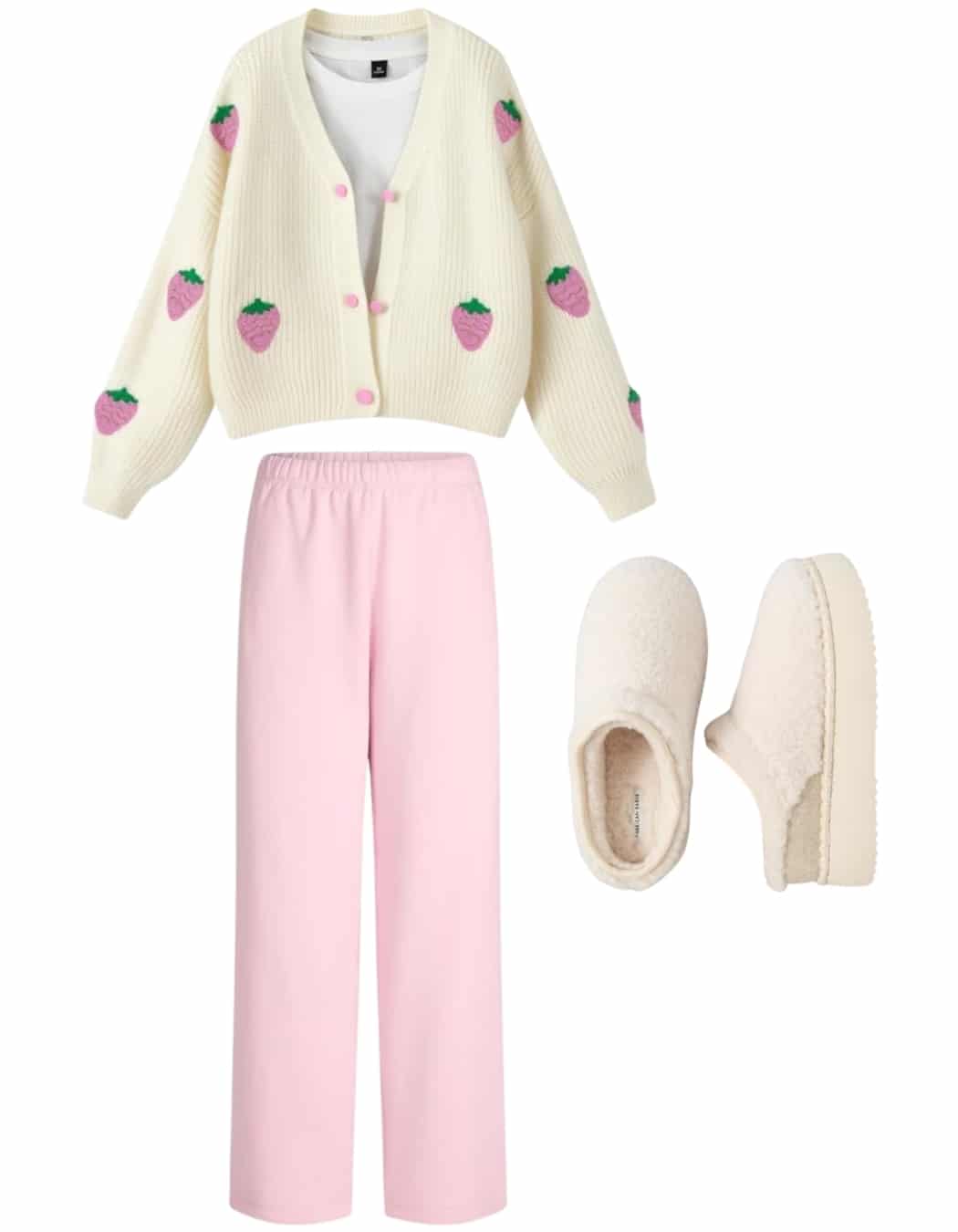 A cozy outfit styling choice—a cream cardigan with pink strawberry motifs, light pink lounge pants, and cream-colored fuzzy slippers—makes for the perfect hangout outfit.