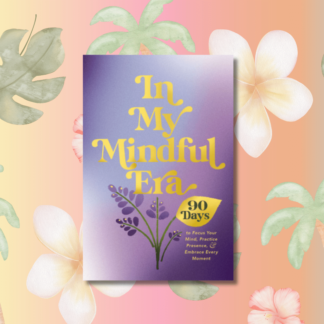 A book titled In My Mindful Era: 90 Days to Focus Your Mind, Practice Presence & Embrace Every Moment on a pastel floral background with green leaves and white flowers. The cover features purple and yellow text and lavender sprigs.