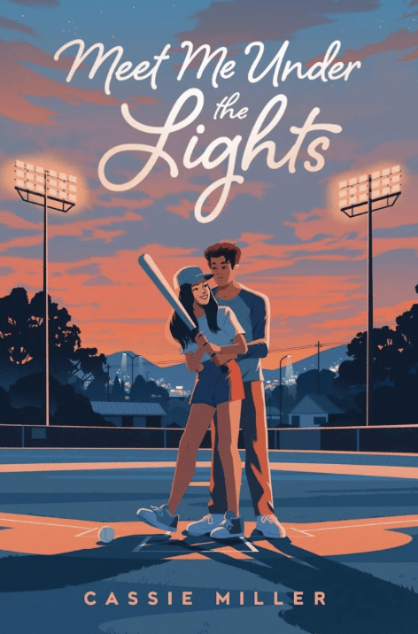 A couple stands embracing on a baseball field at sunset, with stadium lights illuminating the scene. Perfect for your summer reading TBR, the book cover reads Meet Me Under the Lights by Cassie Miller. The woman holds a bat and wears a cap.