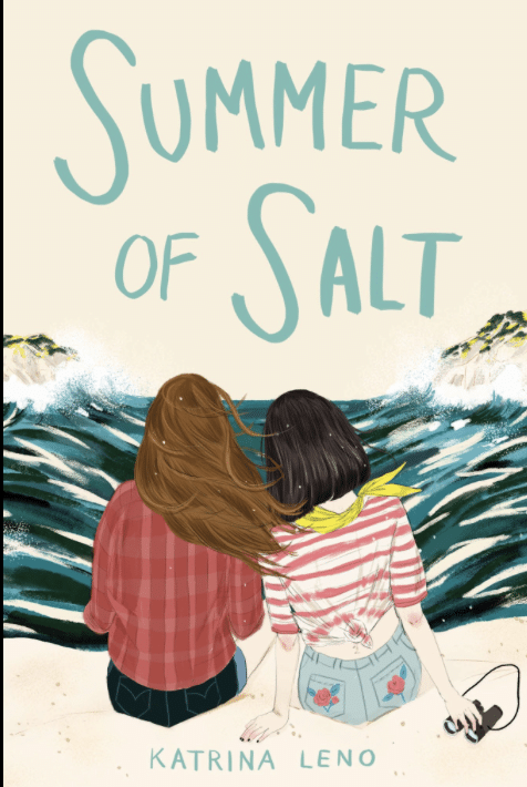 Two girls sit on a beach facing the ocean, one in a red plaid shirt, the other in a striped shirt and shorts, with their hair blowing in the wind. Capturing all the charm of a Whimsy Girl summer, the book title Summer of Salt is above them.