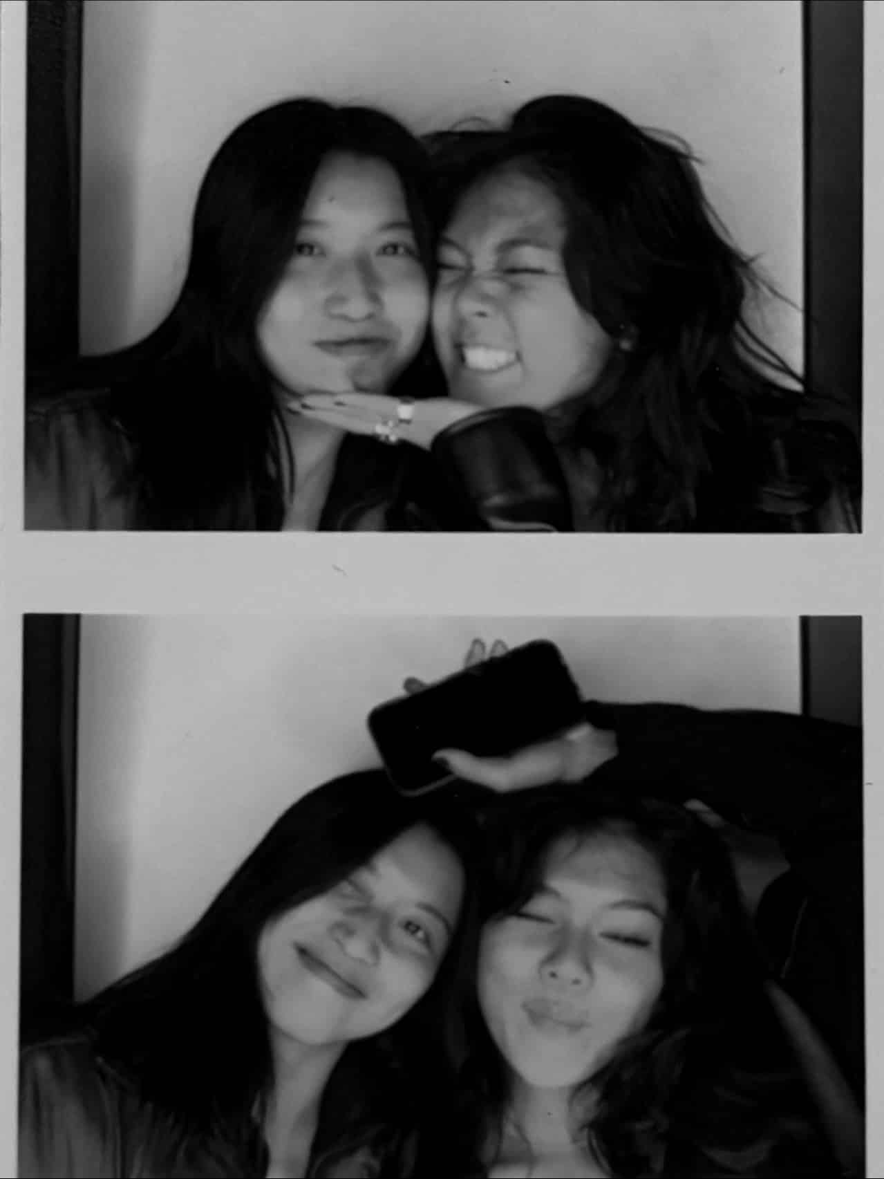 Two young women pose together in a black-and-white photo booth strip, making playful faces; one holds a phone above their heads in the bottom photo, capturing the joy of an end-of-summer BFF reunion and celebrating the warmth of their friendship.