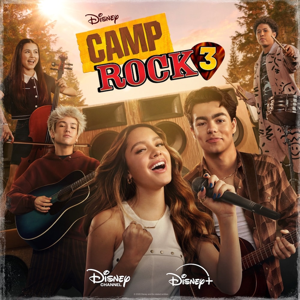 Five smiling teens stand together outdoors with instruments and a microphone, performing in front of large speakers as worlds collide in an epic musical moment. The Disney Camp Rock 3 logo appears at the top, while the Disney Channel and Disney+ logos are at the bottom.