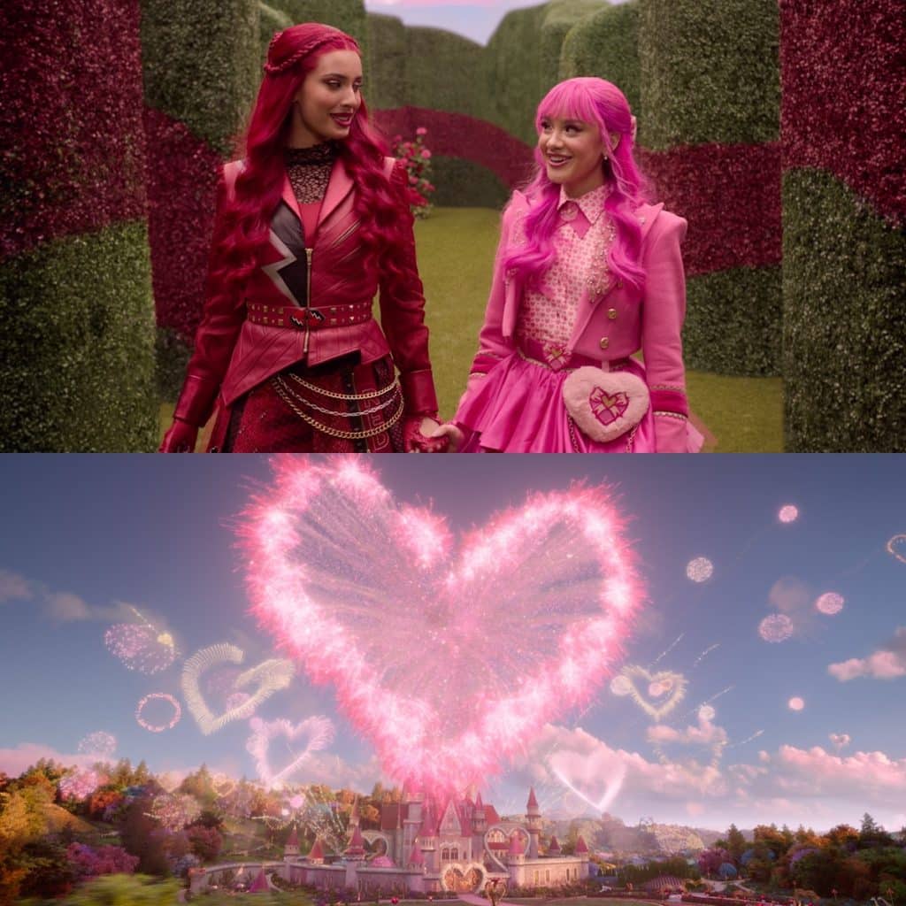 Two girls with pink and red hair and outfits walk hand in hand in a garden; below, a magical castle from the descendants' wicked wonderland is seen under a sky filled with fireworks forming heart shapes.
