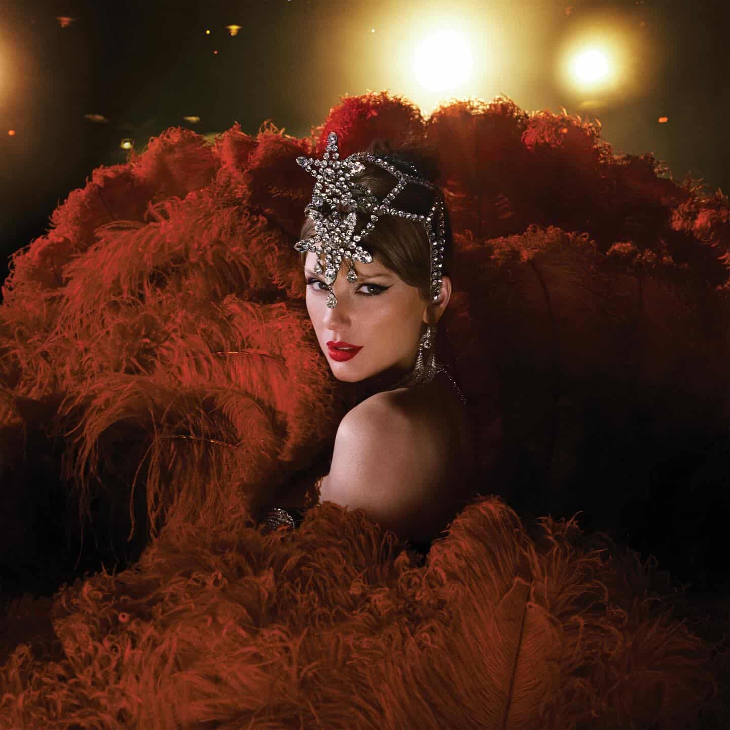 A woman embodying the life of a showgirl—with a jeweled headpiece and striking red lipstick—poses dramatically, surrounded by large red feathers, as bright lights glow in the background.
